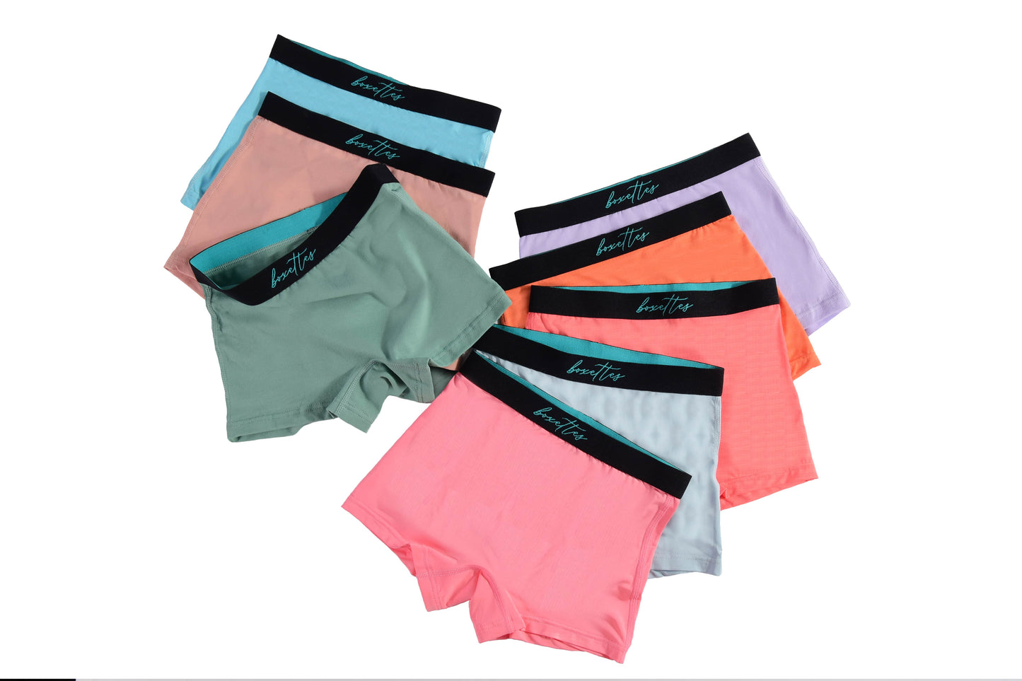 Assorted multi-color girls boxer briefs laid out in a pack from Boxettes
