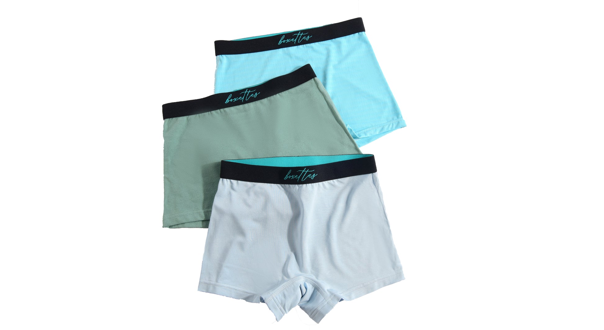 Three girls boxer briefs in green blue and light blue arranged to show stretchy soft fit
