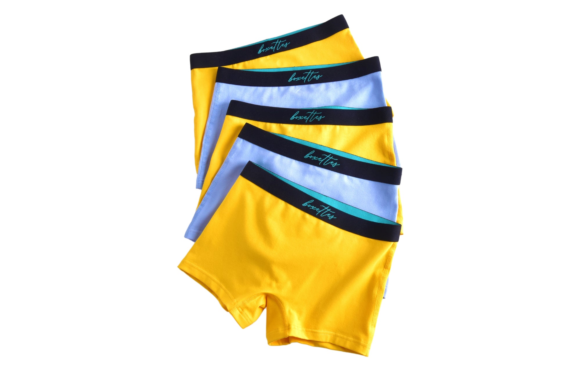 A set of girls' cotton boxer briefs in red and white colors with a wide elastic waistband.