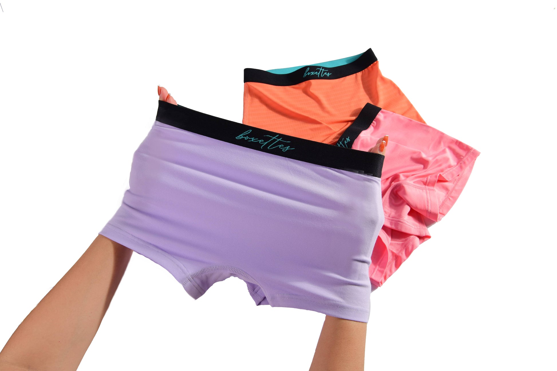 Girls modal boxer briefs in lavender coral and pink being stretched by hand Boxettes