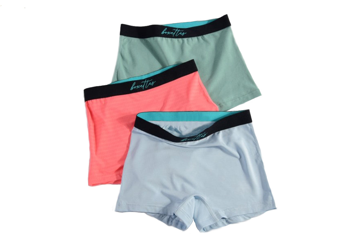 Assorted girls boxer briefs in green coral and light blue with comfort waistbands