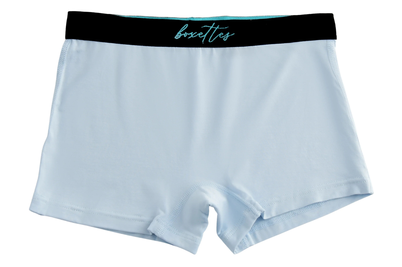 Light blue boxer briefs with a black waistband on a white background