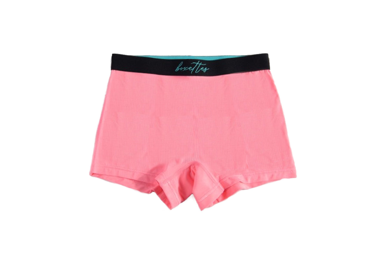 Single pink girls modal boxer brief showing front waistband design by Boxettes