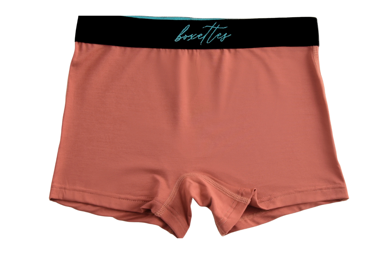 Boxer briefs with a black waistband on a white background